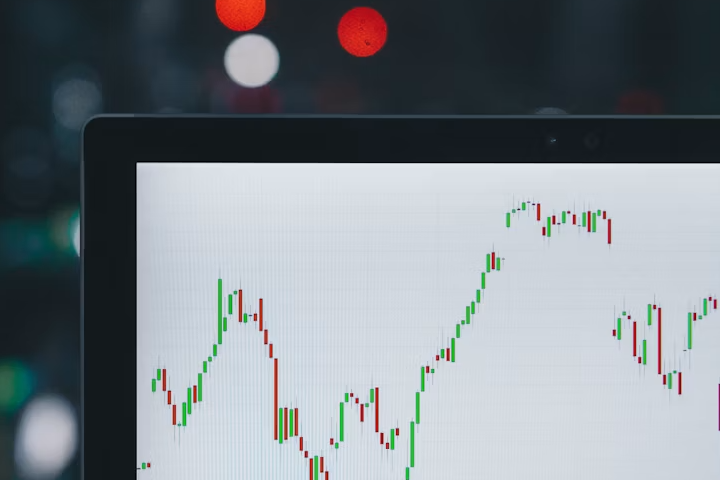 Person reviewing stock watchlist on a laptop screen