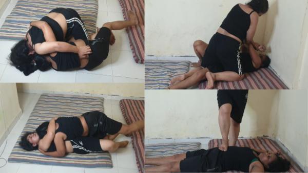 An intense submission wrestling match between Piyali and Anita cover