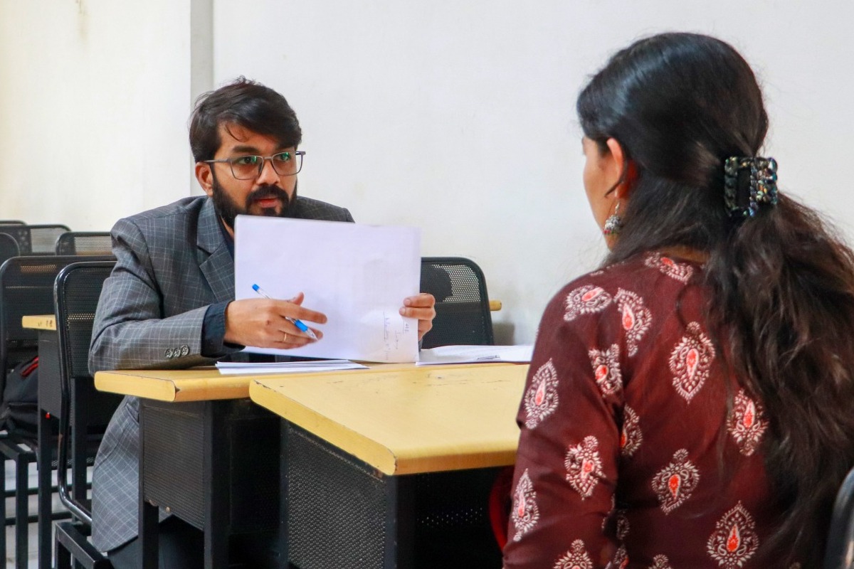 Employers and job seekers networking at the Job Fair