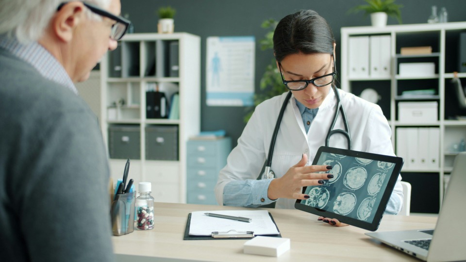 Doctor reviewing neurological patient case